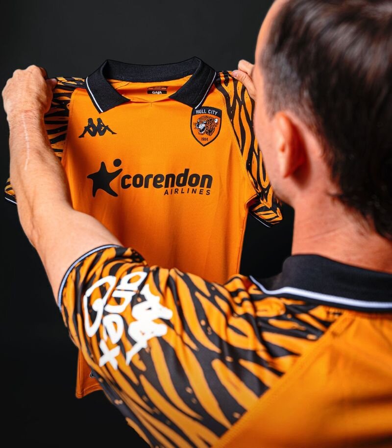 new hull home kit in orange with tiger print sleeves